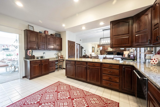 kitchen with recessed lighting, dark brown cabinets, a peninsula, and light stone countertops