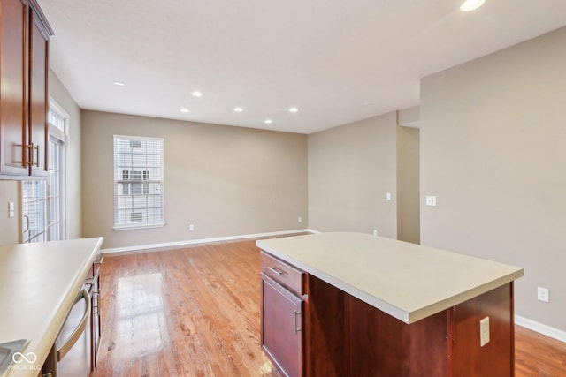 kitchen featuring recessed lighting, light wood-type flooring, baseboards, and light countertops