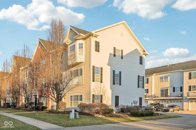 view of property exterior with a lawn