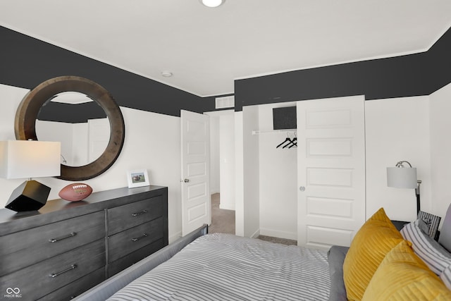 carpeted bedroom with baseboards and visible vents