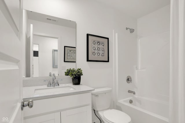 full bathroom with visible vents, toilet,  shower combination, and vanity