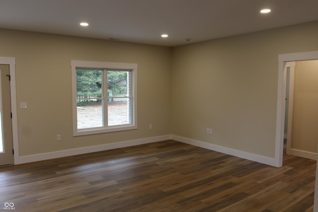 empty room with recessed lighting and baseboards