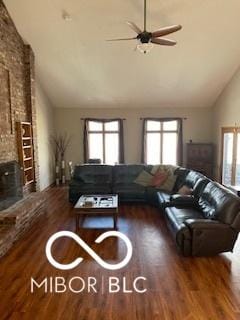 living room with lofted ceiling, wood finished floors, and a wealth of natural light