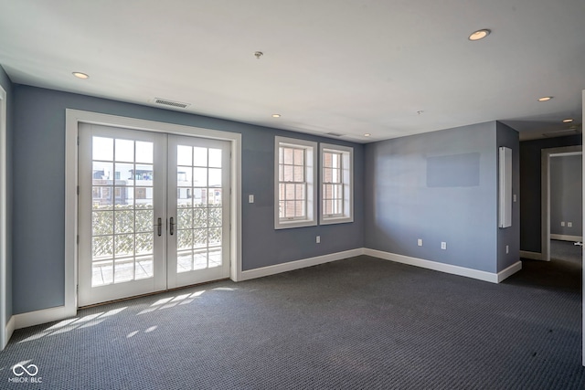 empty room with recessed lighting, french doors, baseboards, and dark colored carpet