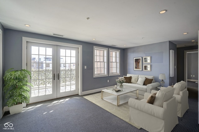 carpeted living room with visible vents, recessed lighting, french doors, and baseboards