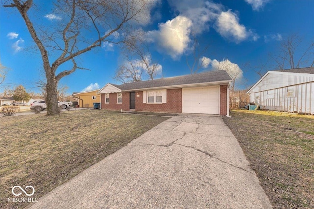 ranch-style home with brick siding, driveway, an attached garage, and a front yard