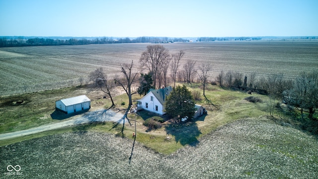 birds eye view of property with a rural view