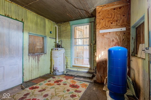 utility room featuring gas water heater