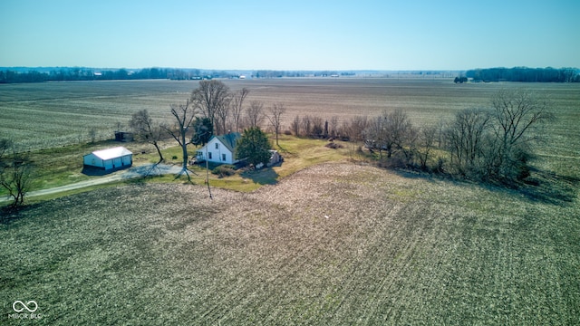 birds eye view of property with a rural view