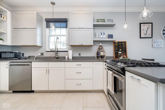 kitchen featuring open shelves, crown molding, appliances with stainless steel finishes, a peninsula, and a sink