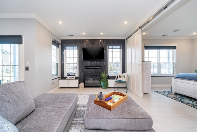 living room with a large fireplace, baseboards, a healthy amount of sunlight, and ornamental molding