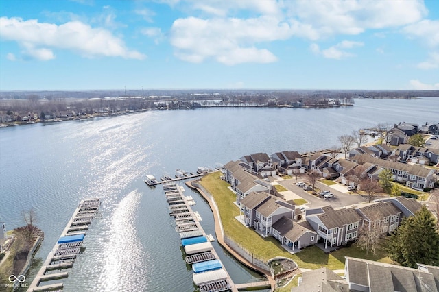 bird's eye view with a residential view and a water view