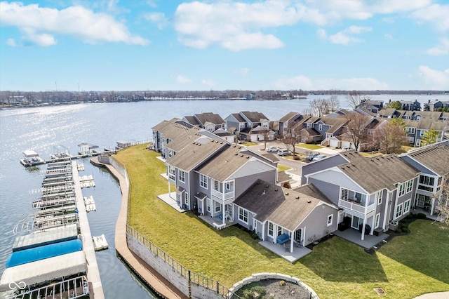 birds eye view of property featuring a residential view and a water view