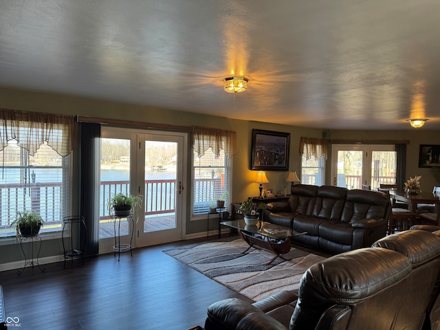 living area featuring wood finished floors and baseboards