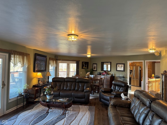 living room with baseboards and wood finished floors