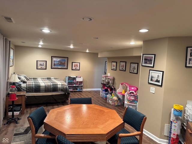 dining room with visible vents, recessed lighting, baseboards, and wood finished floors