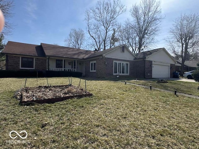 ranch-style house featuring brick siding, a front lawn, covered porch, and an attached garage