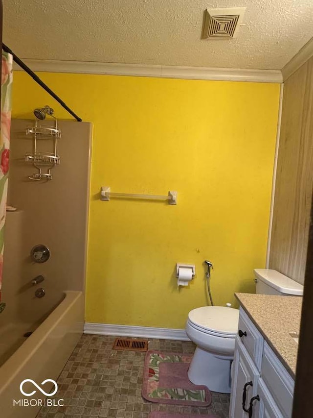 full bath with vanity, visible vents, ornamental molding, a textured ceiling, and toilet