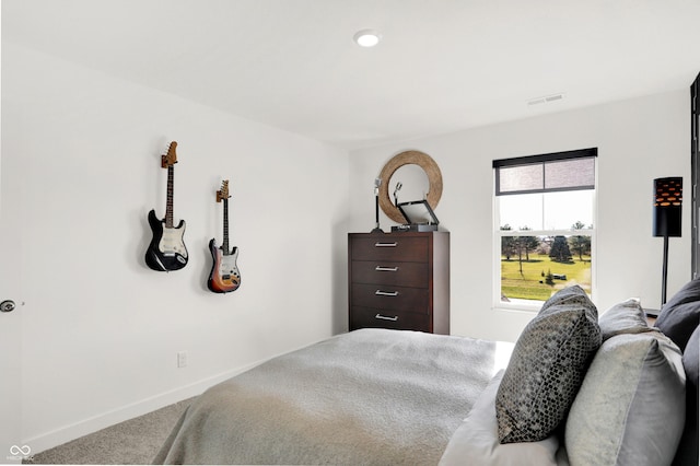 bedroom with visible vents, baseboards, and carpet floors