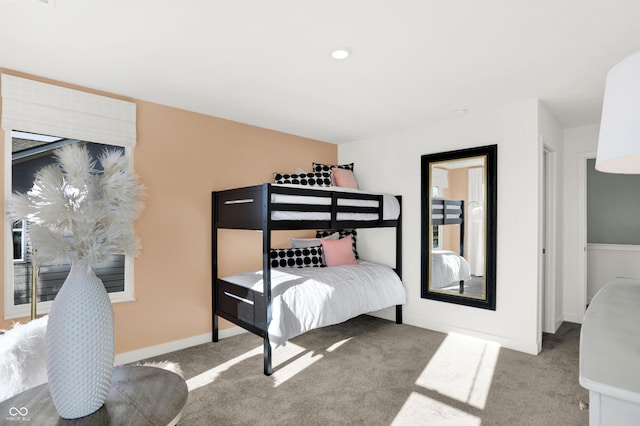 bedroom with carpet flooring and baseboards