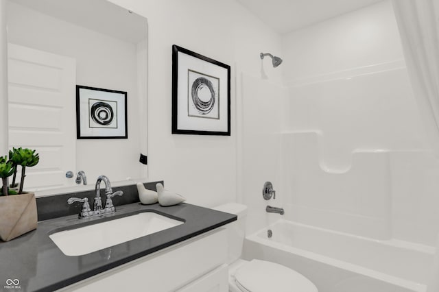 full bath featuring vanity, toilet, and shower / bathtub combination