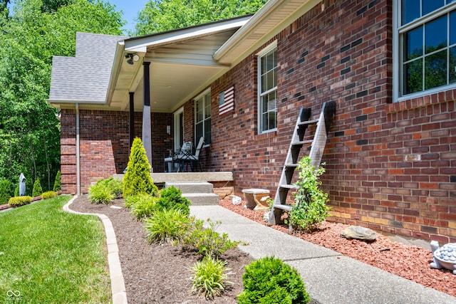 128 Walts Rd, Georgetown, IN 47122 - doorway to property with brick siding, a porch, and a shingled roof
