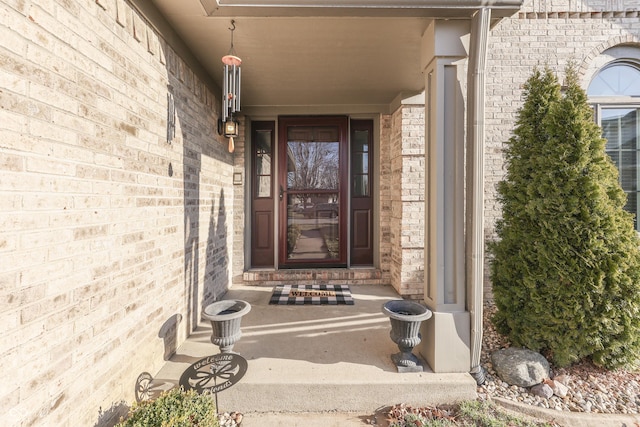 entrance to property with brick siding