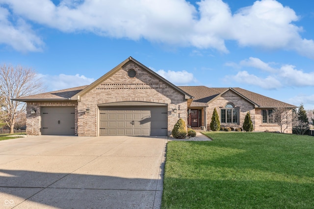 french provincial home featuring a front lawn, a garage, brick siding, and driveway