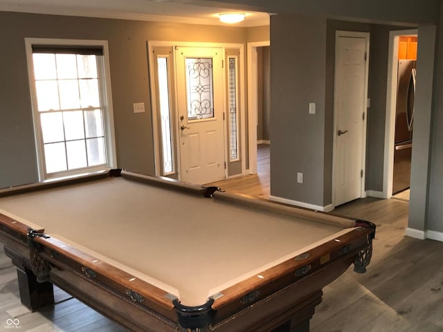 playroom featuring pool table, crown molding, wood finished floors, and baseboards