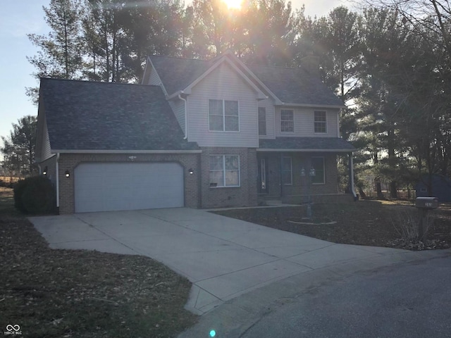 view of front facade featuring a garage, brick siding, a porch, and concrete driveway