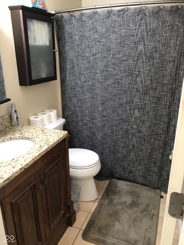 full bathroom featuring vanity, tile patterned floors, toilet, and a shower with shower curtain