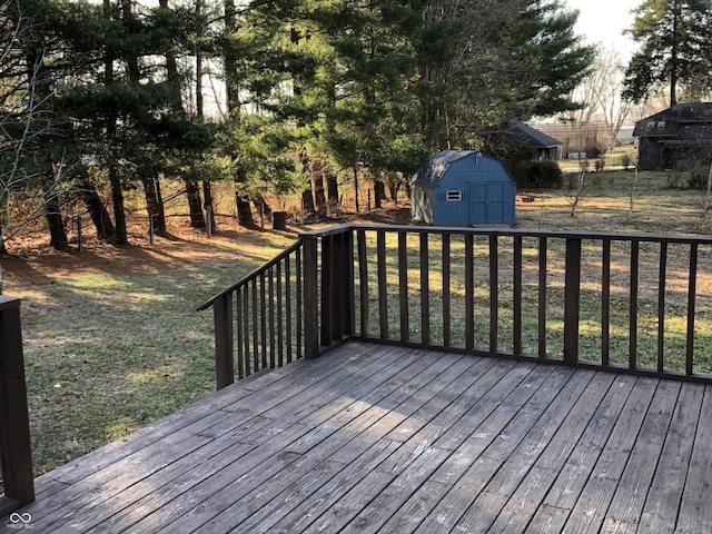 deck featuring a storage unit and an outdoor structure