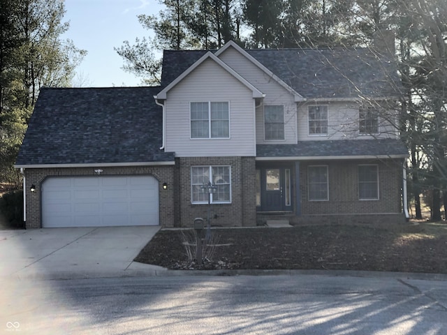 view of front of property featuring a garage, brick siding, roof with shingles, and driveway