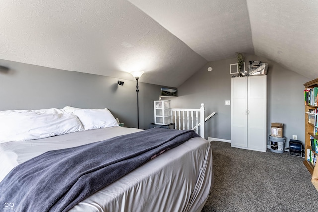 carpeted bedroom featuring baseboards, visible vents, a textured ceiling, and lofted ceiling