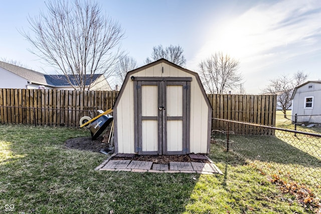 view of shed featuring a fenced backyard