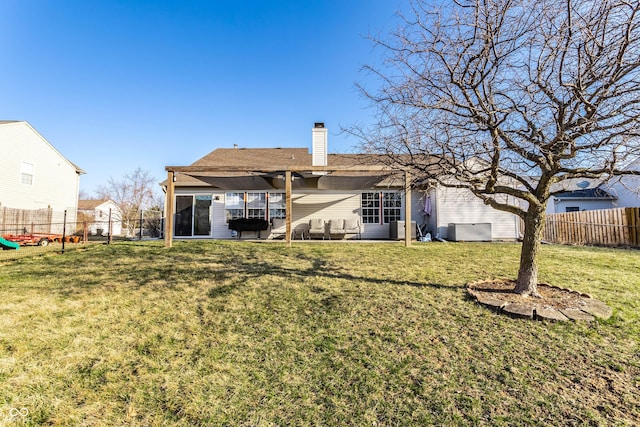 back of house with a yard, a fenced backyard, a chimney, central air condition unit, and a patio area