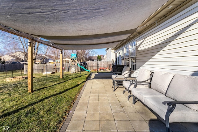 view of patio featuring outdoor lounge area, a playground, and a fenced backyard