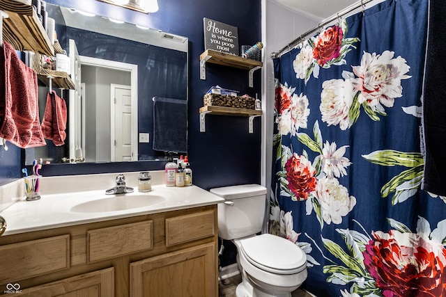 bathroom with visible vents, toilet, vanity, and a shower with curtain