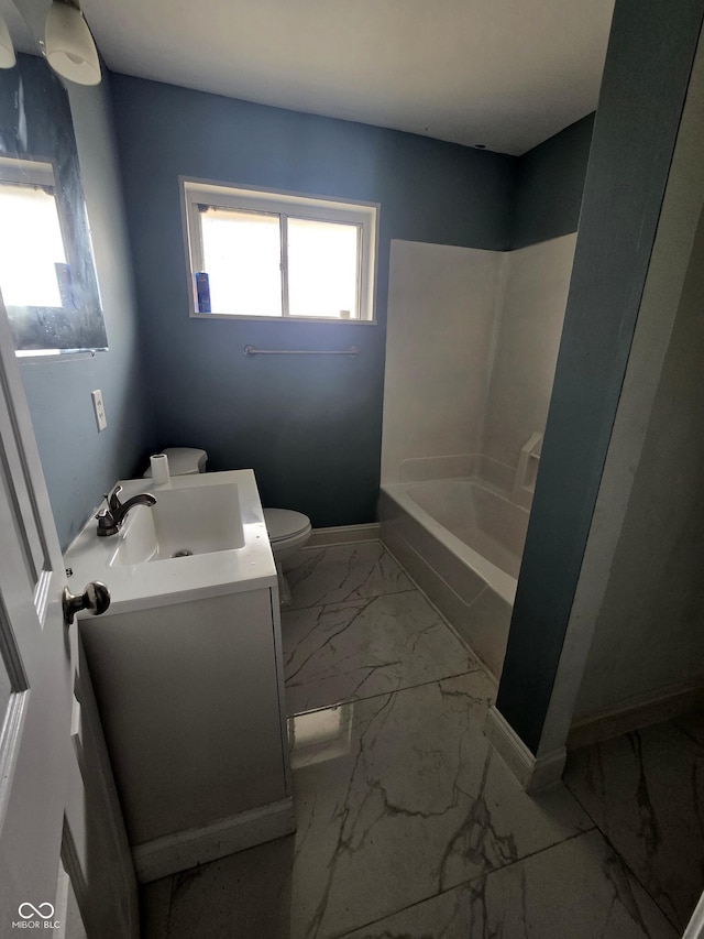 full bath with baseboards, toilet, shower / tub combination, marble finish floor, and vanity