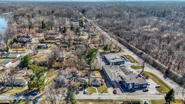 birds eye view of property with a forest view