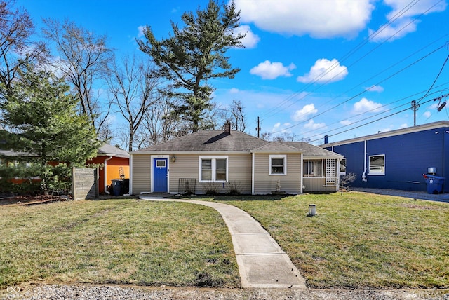 single story home featuring a front yard