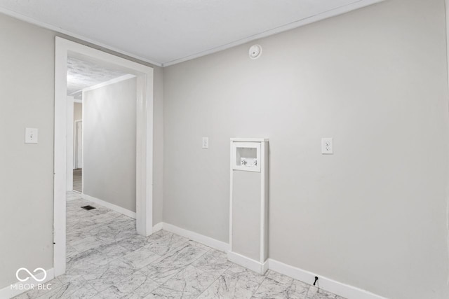 interior space with visible vents, marble finish floor, baseboards, hookup for a washing machine, and laundry area