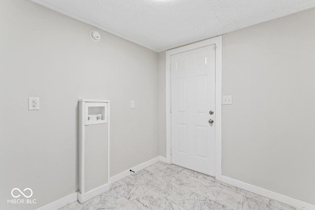 clothes washing area with washer hookup, laundry area, baseboards, and marble finish floor