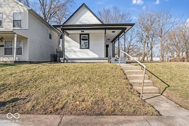 view of front of home with a porch and a front lawn