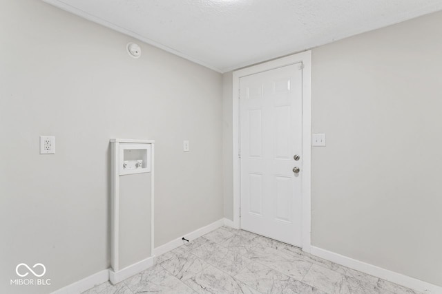 laundry room with baseboards, laundry area, washer hookup, a textured ceiling, and marble finish floor