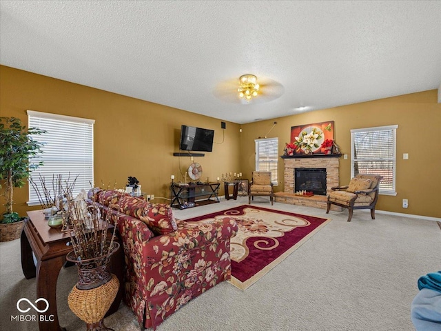 living room with carpet, a fireplace, and a textured ceiling