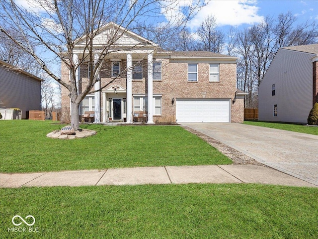 neoclassical / greek revival house with driveway, a front lawn, fence, a garage, and brick siding