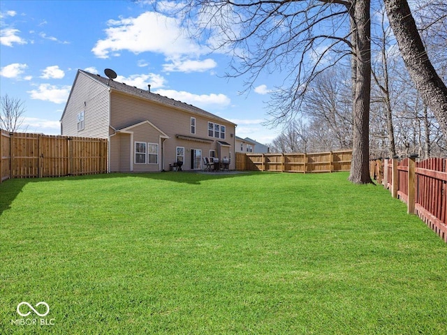 view of yard with a fenced backyard