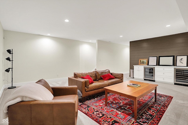 living room featuring recessed lighting, wine cooler, and light carpet