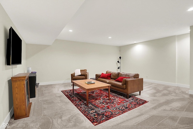 living area featuring recessed lighting, light colored carpet, and baseboards